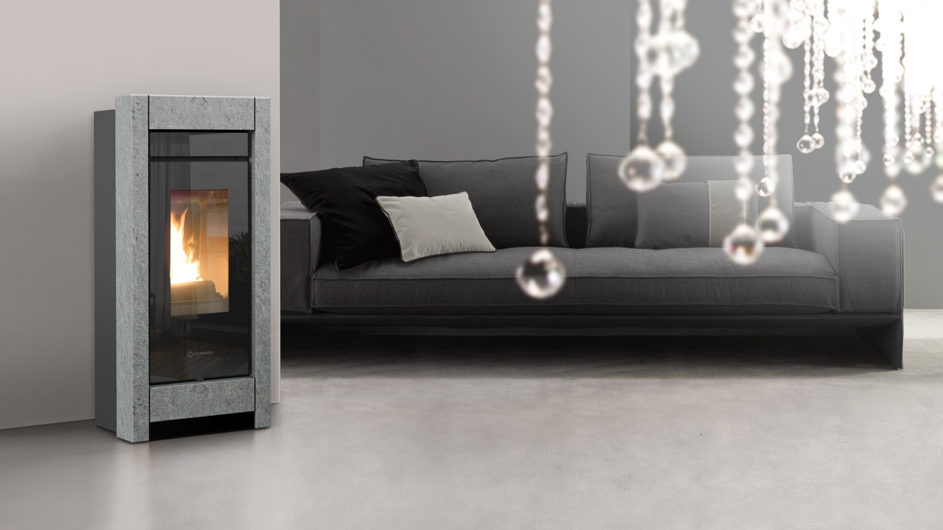 Thermorossi essenza idra 21 stone Evo6 – wasserführender Pelletofen Ofen GmbH ofen.gmbh Thermorossi essenza idra stone Evo6 – Originalfoto des Herstellers im Wohnambiente